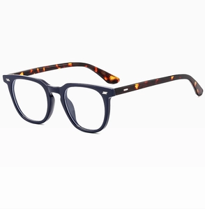 Side view of square blue full-frame glasses with tortoiseshell temples and metal rivets