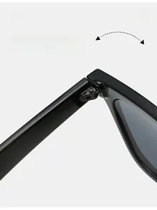 Detailed close-up of durable metal hinge on black retro sunglasses with reinforced screws