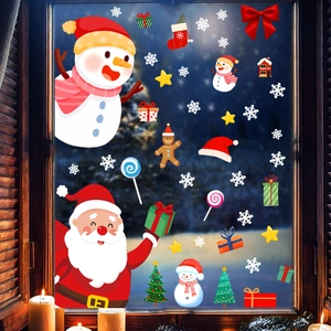 Window display of Santa and Snowman static stickers on glass with winter night background