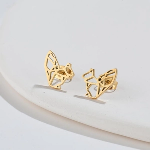Macro shot of gold stainless steel squirrel earrings with minimalist origami design