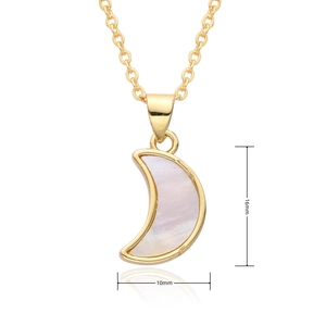 Detail view of gold crescent moon pendant with dimensions 16mm by 10mm and pearl inlay