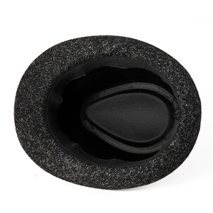Close-up of the interior black lining and sweatband of a vintage gentleman's jazz hat