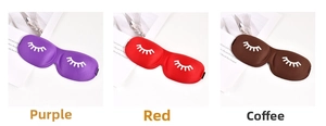 Three 3D contoured sleep masks in purple, red, and brown with cute eyelash patterns