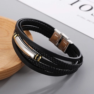 Detail showing multi-layer black leather bracelet with silver stainless steel tube and magnetic clasp