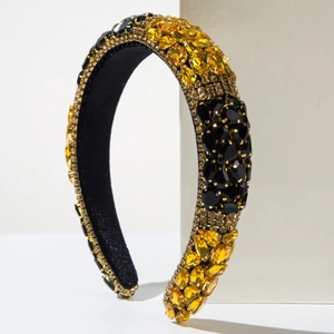 Macro detail of luxury baroque sponge headband with amber and black crystal beadwork