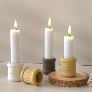 Detail showing anchor and clover embossed candle holders in various matte colors