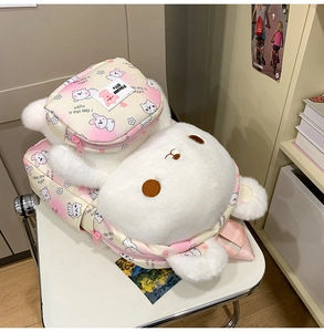 Detail of cute white plush rabbit backpack featuring a small pink hero printed pouch
