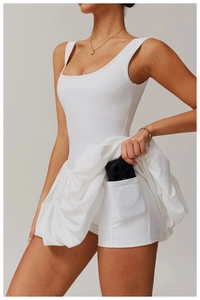 Detail shot of white tennis dress showing a hidden functional side phone pocket on shorts