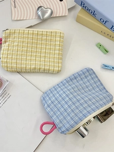 Checkered fabric zipper pouch set in yellow and blue colors for cosmetics and keys