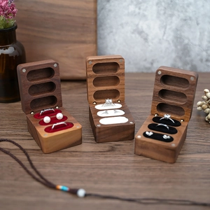 Black walnut jewelry box with velvet lining in red white and black for rings