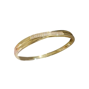 18k gold plated bangle with double row pavé cubic zirconia on a polished metal band