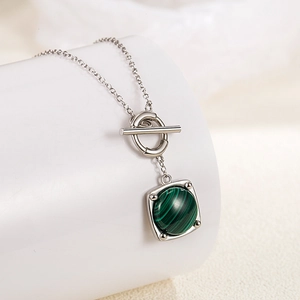 Elegant S925 silver necklace with green malachite pendant and OT buckle on white pedestal