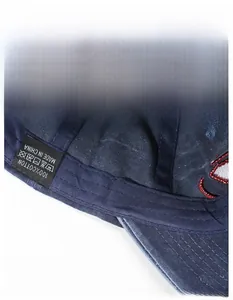 Detail of 100% cotton baseball cap interior showing moisture-wicking sweatband and stitching