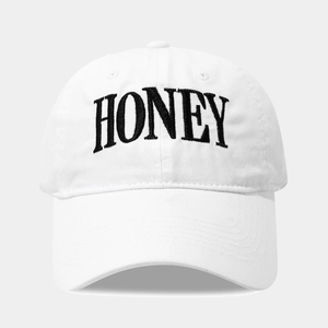 Classic white cotton baseball cap with black HONEY embroidery in a minimalist style