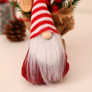 Close-up of knit Christmas gnome ornaments with fuzzy beards and pine cone festive decor