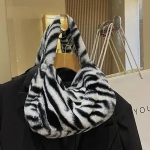 Fashionable zebra print faux fur hobo bag with soft plush texture for women's shoulder wear