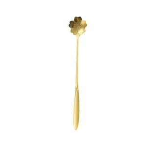 Golden stainless steel cherry blossom spoon with elegant flower-shaped handle on white background