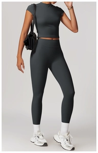 Deep grey high waist yoga set with tight long-sleeve crop top and high-stretch sports pants