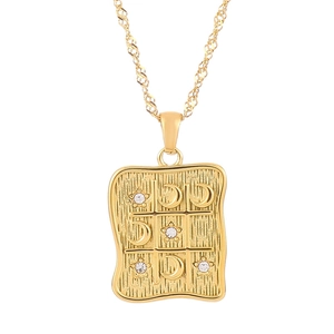 Gold stainless steel rectangle pendant necklace with celestial tic-tac-toe pattern and zircons