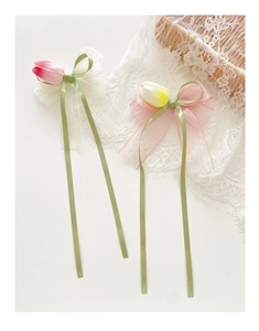 Detail of Korean style tulip hair clips with elegant long ribbons and sheer tulle fabric