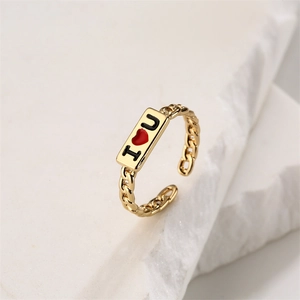 Macro detail of gold chain texture ring featuring engraved I love U heart square plaque