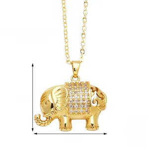 Close-up of gold plated elephant necklace with white zircon stones and hollow carving detail