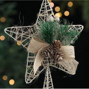 Detail of glitter rope wrapped star tree topper with pine cones and burlap bow knot