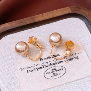 Boucles d'oreilles élégantes avec perles rondes et cristal ambré sur argent doré