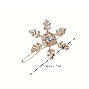 Elegant gold snowflake hair clip with white rhinestones on white background 5.4cm