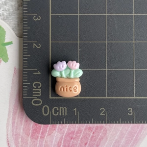 Mini resin flower pot charm with nice text on cutting mat for DIY jewelry making