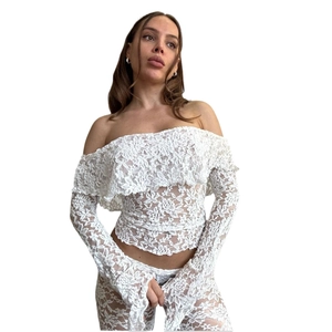 White lace off-shoulder long sleeve top and flared pants set with ruffle detail