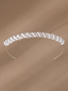 Detail of handcrafted bridal headband with white faux pearls and faceted crystal beads