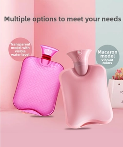 Detail of pink PVC hot water bottles with non-slip texture and wide funnel opening