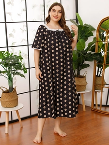 Close-up of neckline with white lace trim and bow on black floral plus size nightgown