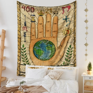 Detail view of Bohemian wall tapestry with mystical hand, earth, and hourglass motifs