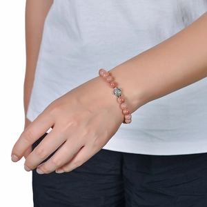 Detailed view of 8mm amazonite beaded bracelet with a silver turtle charm on wrist