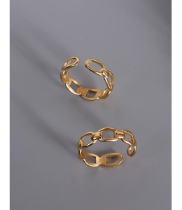 Detail view of two gold-plated chain-link rings with an open adjustable design