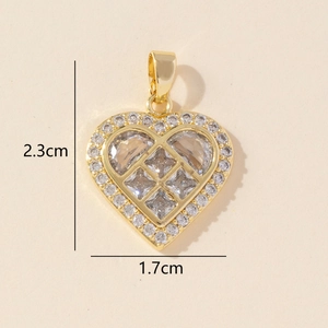Detailed macro view showing the 2.3cm by 1.7cm dimensions of the gold heart pendant