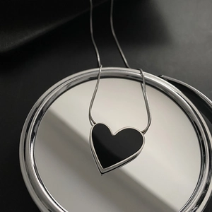 Minimalist irregular heart necklace with black enamel pendant and silver snake chain