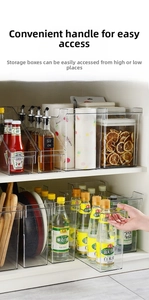 Macro shot of clear plastic cabinet storage box with handle for kitchen organization