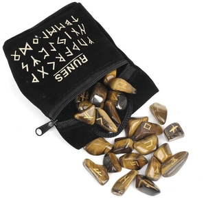 Tiger's eye crystal runes set with black velvet drawstring bag on a white background