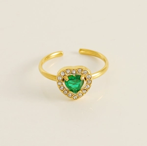 Detailed macro view of an 18K gold ring with green heart-shaped zircon and halo diamonds