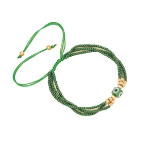 Handmade green bead woven bracelet with evil eye charm in bohemian style