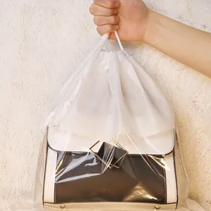 Transparent drawstring dust bag for handbag storage and closet protection