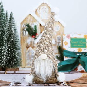 Close-up of Nordic Christmas gnome plush with white beard and brown knit hat