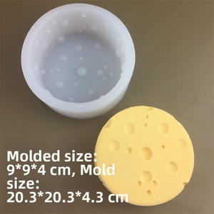 Macro detail of round silicone cheese mold with product size dimensions and yellow sample