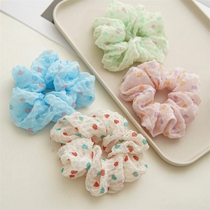 Chiffon scrunchies with colorful heart patterns in blue, green, pink, and cream white