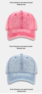 Close-up of washed denim texture on red and blue cotton baseball caps with stitching
