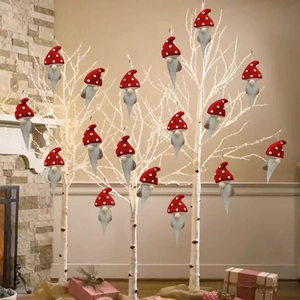 Set of 16 Christmas gnome plush ornaments hanging on a white decorative tree branch