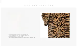 Close-up of thick tiger print faux fur texture and dense fibers on men's winter coat